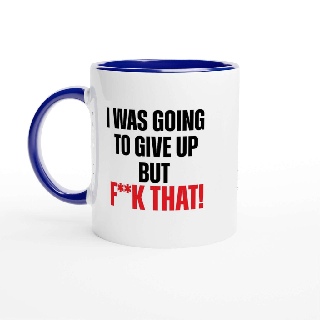 White ceramic mug with blue handle and rim, featuring the text "I was going to give up but f**k that!" in bold black and red letters.