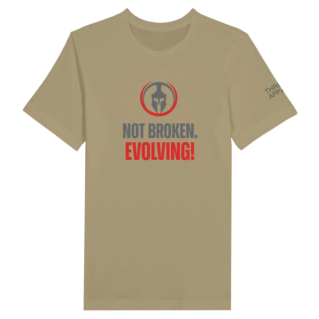 Premium unisex crewneck t-shirt featuring "Not Broken. Evolving!" motif and Spartan logo, promoting strength, resilience, and continuous growth.