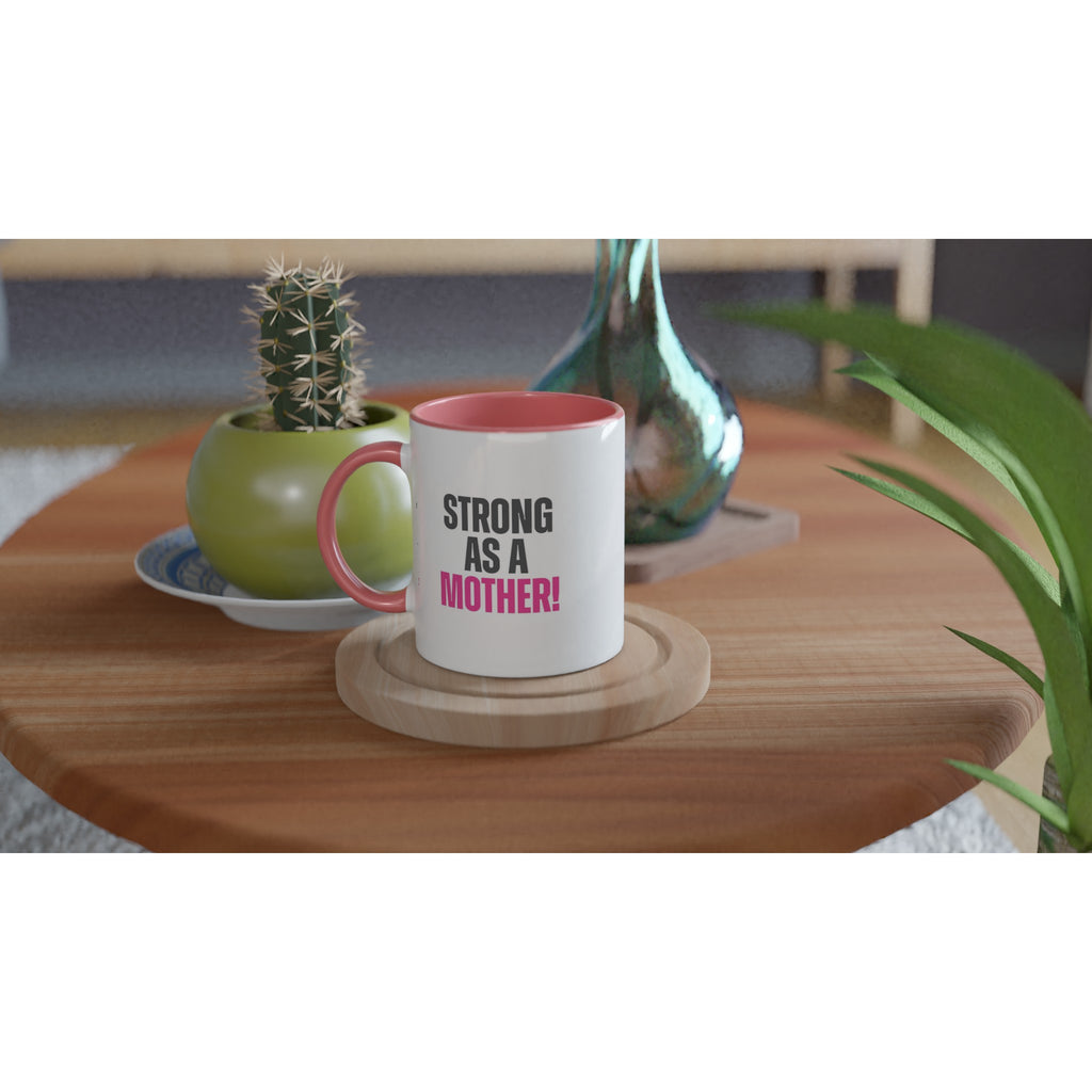 "Strong as a Mother" ceramic 11 oz mug with pink rim and handle on wooden table, perfect for modern moms.