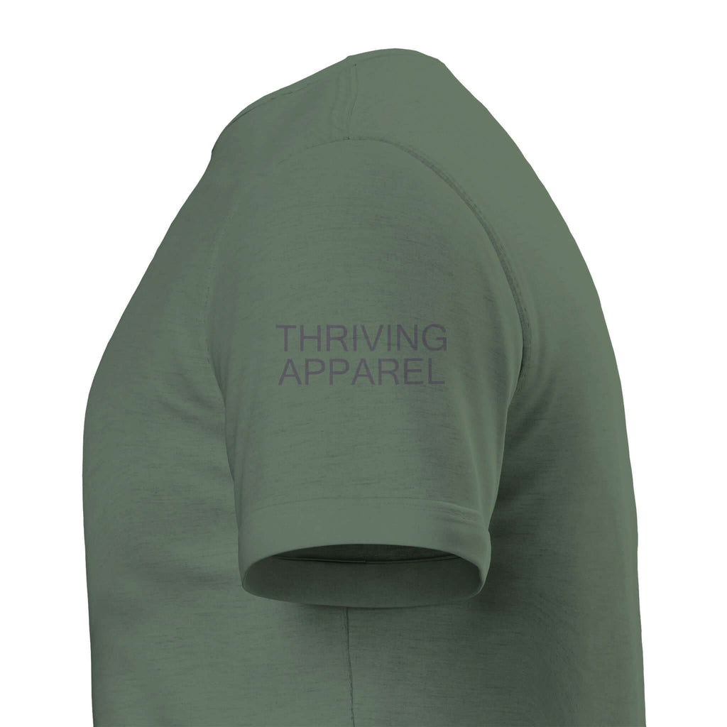 Premium eco-friendly green tee with "Thriving Apparel" text on sleeve, unisex tailored fit for comfort and style.